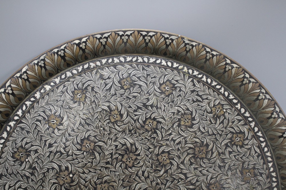 A Cairoware brass inset pewter tray, diameter 54cm